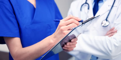 Home doctor and nurse helping patient